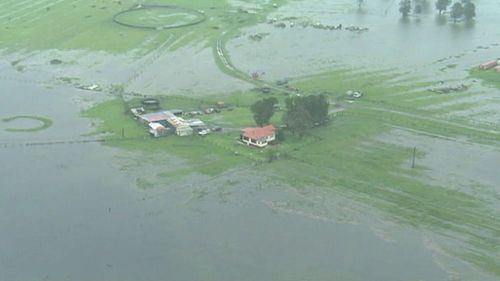 Flash flooding from the rising Williams River prompted an evacuation order. (ABC)