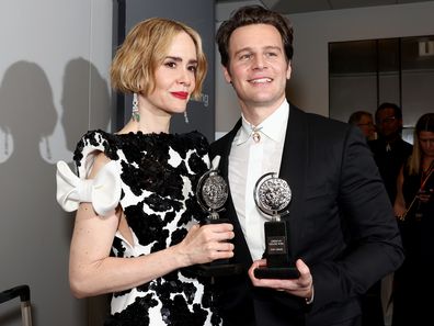 Sarah Paulson and Jonathan Groff pose with awards in the press room during the 77th Annual Tony Awards on June 16, 2024 in New York City. 