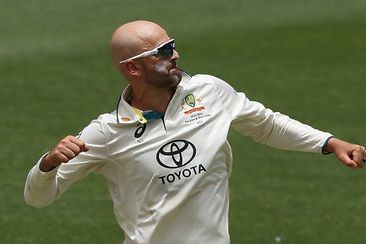 Nathan Lyon of Australia celebrates the wicket of Imam-ul-Haq of Pakistan during day three of the Men&#x27;s First Test match between Australia and Pakistan at Optus Stadium on December 16, 2023 in Perth, Australia (Photo by Paul Kane/Getty Images)