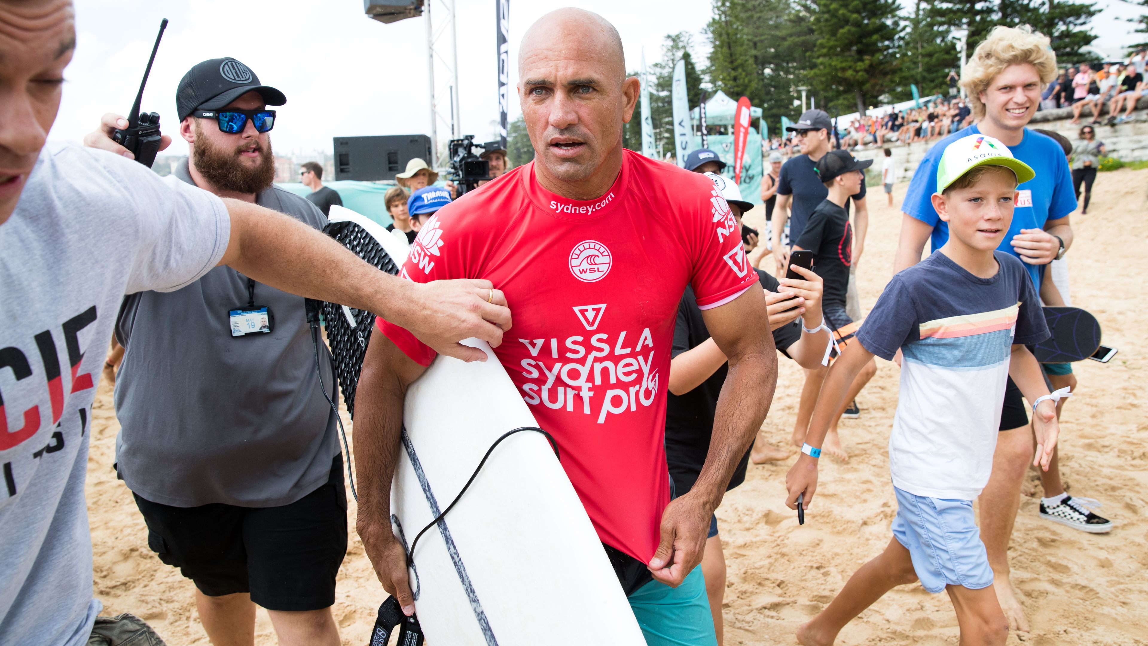 Kelly Slater emerges from the water after competing in the Vissla Sydney Surf Pro at Manly Beach, Sydney in 2019.