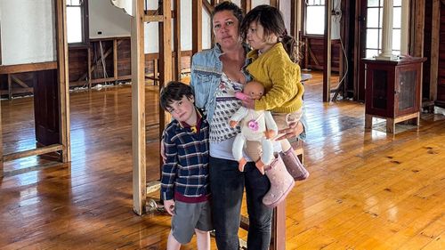 Lismore mum Crystal Lenane in what remains of her home.