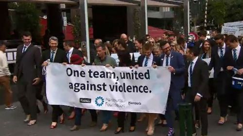 Staff in Melbourne marched along Southbank before ending up at Federation Square. (9NEWS)