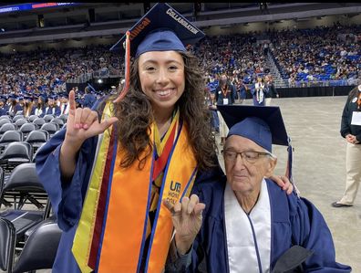 Grandfather and granddaughter grad