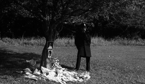 A policeman standing guard next to a tree surrounded by floral tributes in Wild Park, Brighton, where the bodies of Nicola Fellows, 10, and Karen Hadaway, 9, were found. 