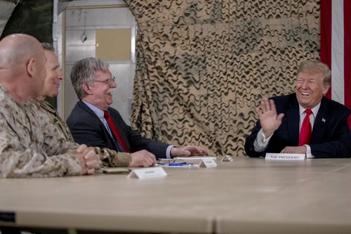 Mr Trump, with National Security Adviser John Bolton, during the top secret visit.
