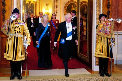 King Charles III and the Queen Consort, Prince William and Princess of Wales arrive at a Diplomatic Corps reception at Buckingham Palace on December 6, 2022 in London 