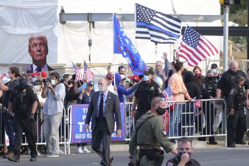 President Donald Trump supporters gather outside Walter Reed National Military Medical Center. Mr Trump was admitted to the hospital after contracting COVID-19. 