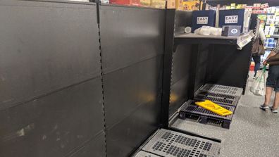 Empty toilet paper shelves at an Aldi store in Bondi Junction.