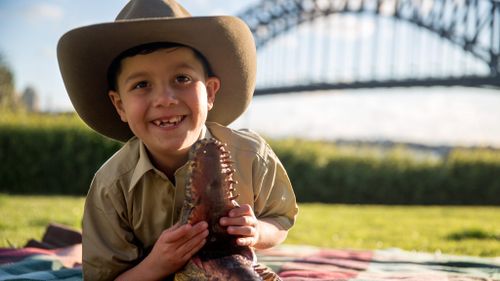 Seven-year-old Gabriel Cipriano practices his crocodile-wrangling skills in preparation for his Outback adventure. (AAP)