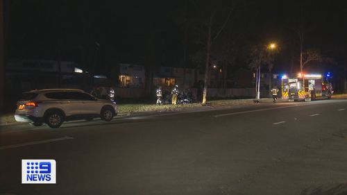 Two men have been arrested after they allegedly took an injured man away from the scene of a fiery crash in a shopping trolley and left another 12-year-old boy with injuries in Sydney's west.