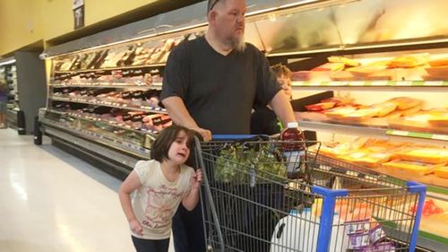 Dad drags girl by the hair in supermarket