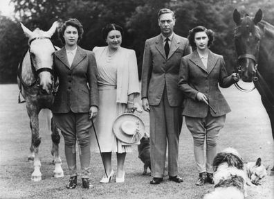 The two princesses, Elizabeth, left, and Margaret Rose, right, pose with Their Majesties, Queen Elizabeth and King George VI, before setting off on their daily canter at Windsor Castle in 1946.