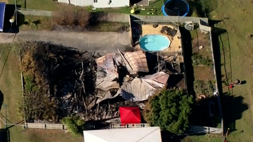 The remains of a Queensland property destroyed by fire.