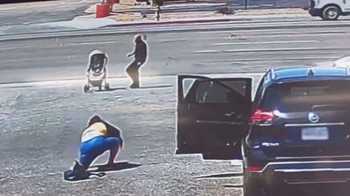 Man saves baby boy from rolling into busy traffic in stroller. 