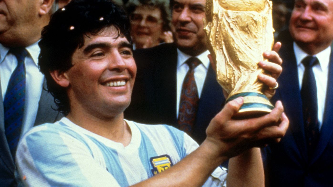 Diego Maradona holds up the World Cup trophy in 1986