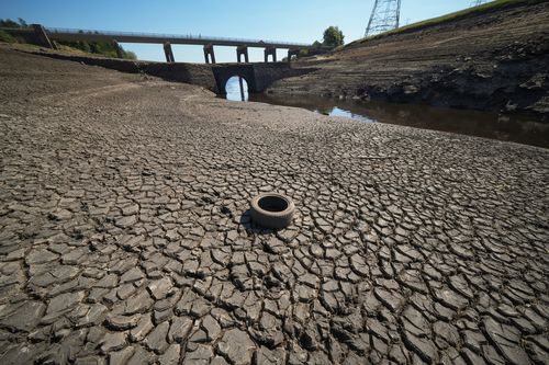 Low water levels at Baitings Reservoir reveal an ancient pack horse bridge as drought conditions continue in the heatwave on August 12, 2022 in Ripponden, United Kingdom. 