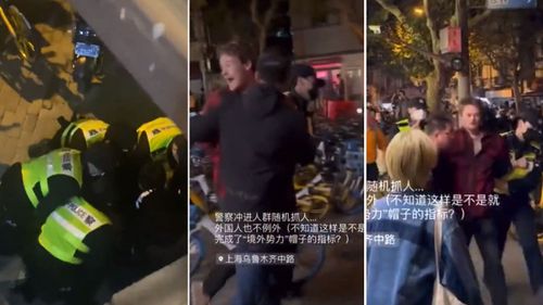 BBC journalist Ed Lawrence is arrested and led away by police in China.