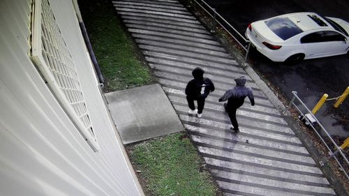 Police released CCTV footage of two men walking near Kelso Park soccer club not long after Mejid Hamzy was shot dead.