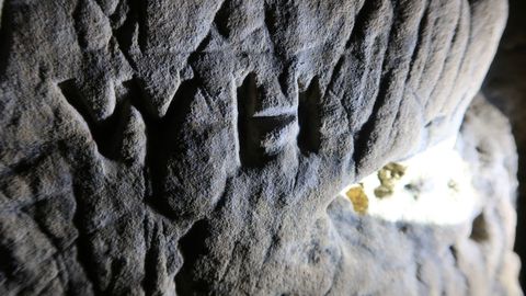 The eerie markings in the cave were made to warn people of evil figures inside, experts believe.