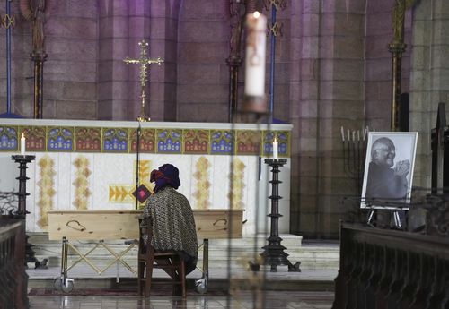 Mpho Tutu, sits with her fathers coffin Anglican Archbishop Emeritus Desmond Tutu  at the St. Georges Cathedral in Cape Town, South Africa, Saturday, Jan. 1, 2022.  