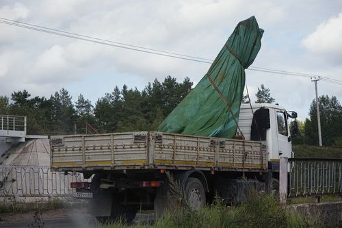 A truck carries a part of a private jet crashed near the village of Kuzhenkino, Tver region, Russia, Friday, Aug. 25, 2023. 