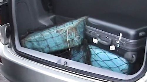 The parcels of heroin found in the back of the rented Toyota Tarago.