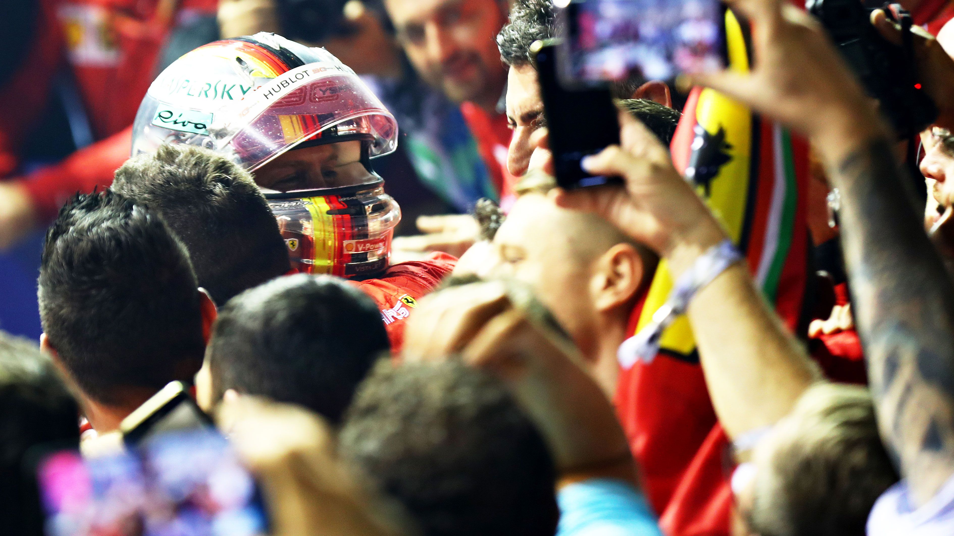 Sebastian Vettel celebrates after winning the 2019 F1 Grand Prix of Singapore at Marina Bay Street Circuit.