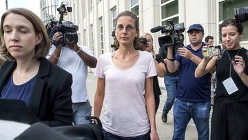 Clare Bronfman, an heiress to the Seagram's liquor fortune, has been allegedly linked to a self-improvement organisation accused of branding some of its female followers and forcing them into unwanted sex. (AAP)