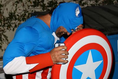 A plastic Captain America shield is the perfect paparazzi deterrent, right Gerard?