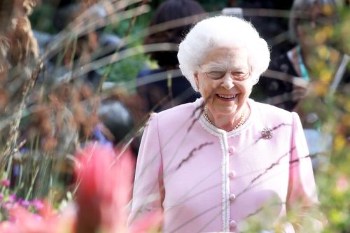 The Queen was clearly delighted with this year's flower displays at her first official event since the royal wedding (AAP)