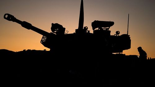 Israeli artillery train their guns towards the Gaza strip on November 21, 2023 in Southern Israel.