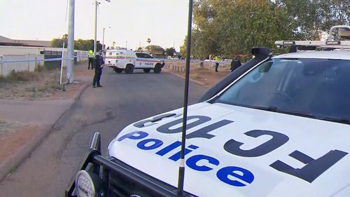 Police stand watch as a forensic search of the house in Carnarvon where Cleo Smith was found is conducted.