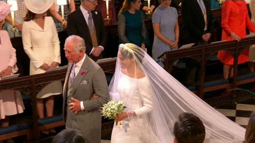 Meghan Markle was walked up the aisle by Prince Charles.