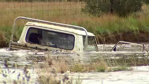The body is believed to be that of a missing farmer whose ute was swept away by floodwaters on Wednesday.