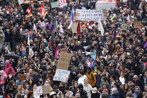 Demonstrators march Thursday, April 6, 2023 in Nantes, western France. 