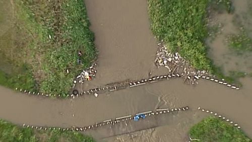 There are fears the boy has been swept into Dandenong Creek. (9NEWS)