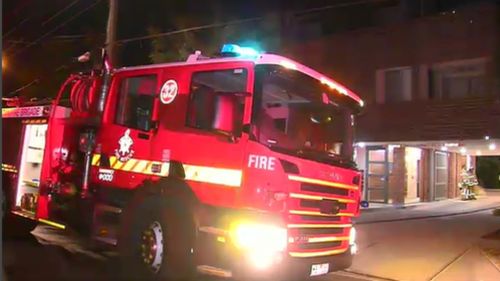 PSOs called in emergency services after they were unable to free the man in the smoke-filled apartment. (9NEWS)