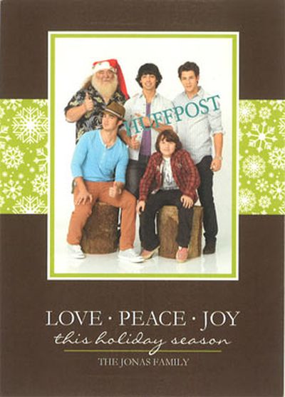 The Jonas Brothers posed with <strike>a scary hobo</strike> their dad(?) for this family greeting card.