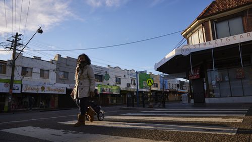 A pedestrian is seen in the suburb of Lakemba in Sydney.