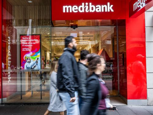 People walk past a Medibank outlet in Sydney.