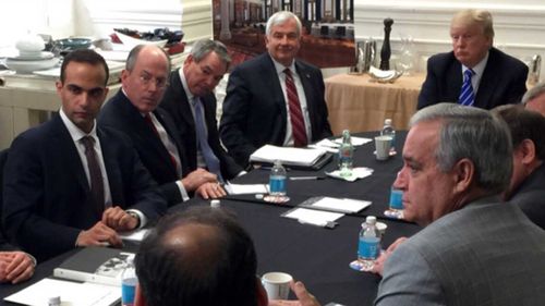 George Papadopoulos (left) in a meeting with now-President Donald Trump.