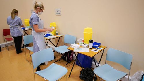 Medical vaccination staff prepare to receive young patients in Newcastle, England.