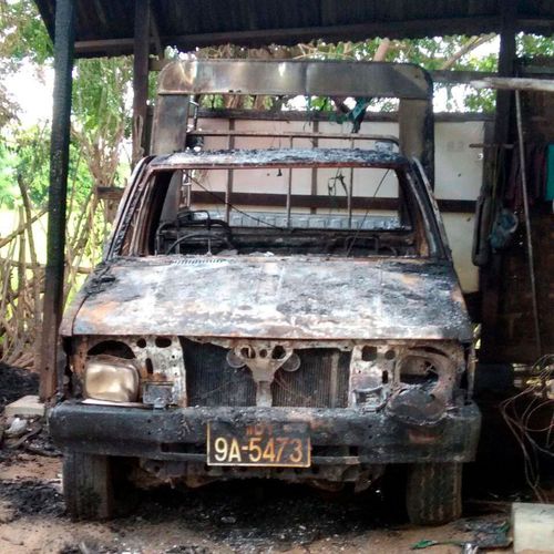 A burnt vehicle stands within a monastery that houses a middle school in Myanmar that was attacked by government forces