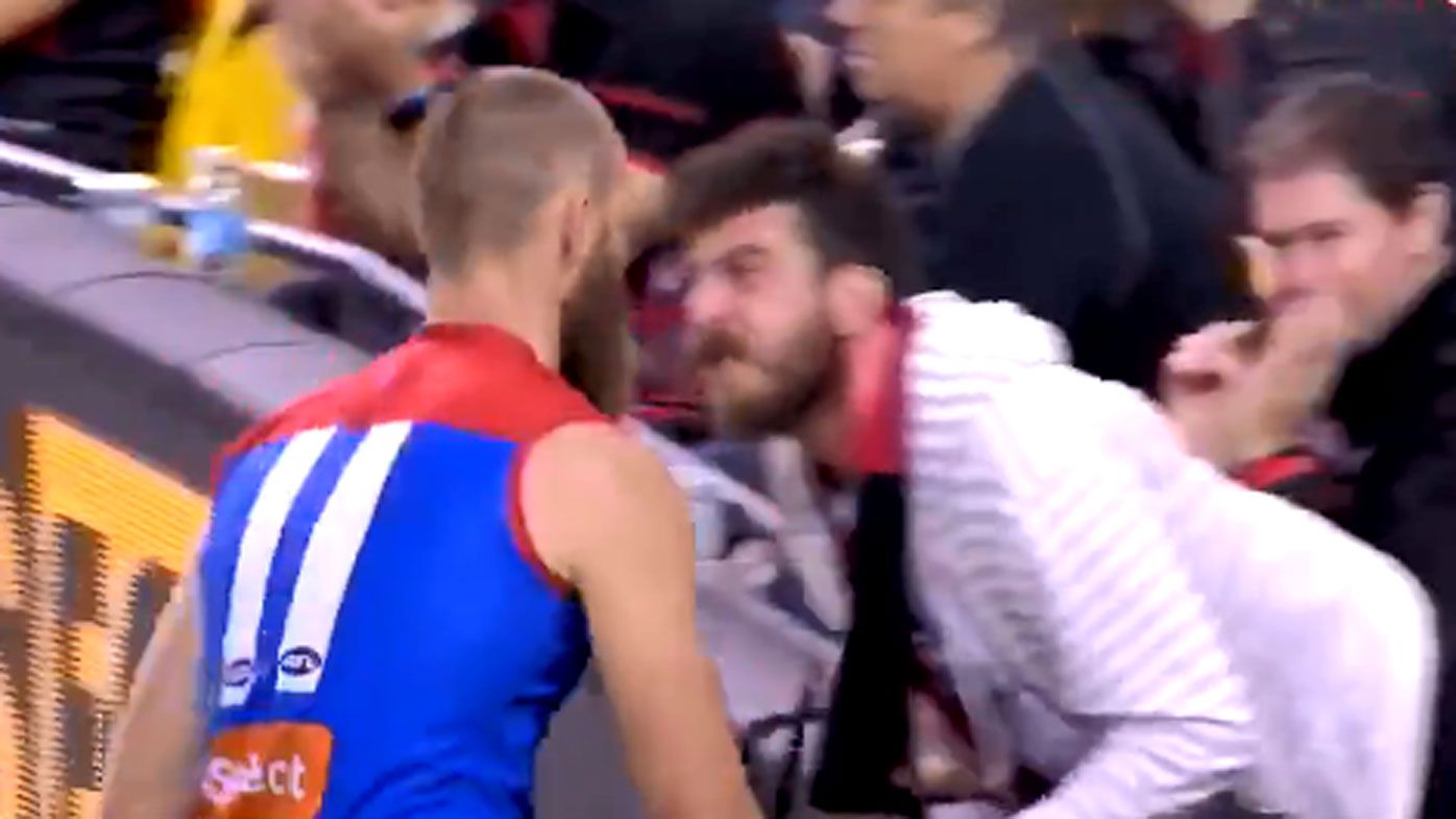 Demons ruckman Max Gawn cops it from unruly Bombers fan