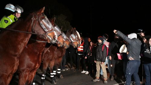 Protesters have clashed with police outside a venue where Canadian far-right activist Lauren Southern is speaking in Melbourne. (AAP)