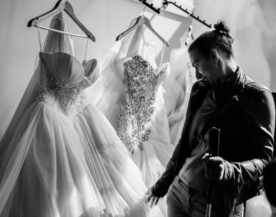 Steph browses dresses, by touching them.