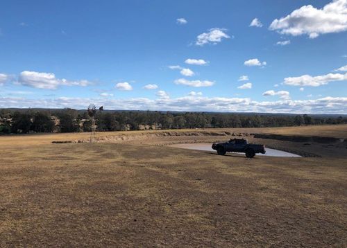 Farmer Brett Hayter's land is stricken by drought in Wollondilly, an hour out of Sydney.