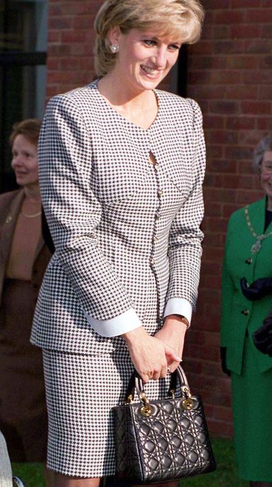 BIRMINGHAM, UNITED KINGDOM - OCTOBER 31 1995:  Princess Diana, Patron, Opening The National Institute Of Conductive Education At Cannon Hill House, Russell Road, Moseley, Birmingham.  The Princess Is Wearing A Black And White Houndstooth Check Suit And She Is Carrying A Christian Dior Black Handbag.  (Photo by Tim Graham Photo Library via Getty Images)
