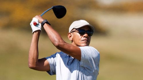 Mr Obama teed off to a round of applause from onlookers. (Getty)