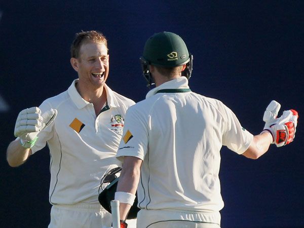 Adam Voges and Steve Smith celebrate at the end of play. (AAP)
